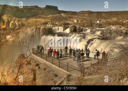 A crowd of people view Shoshone Falls from the overlook, in spring during a period of high flow, Twin Falls, Idaho Stock Photo