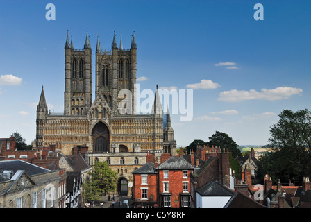 The magnificent Lincoln Cathedral and surrounding Castle Hill seen from above  with red tiled roof tops and historic buildings Stock Photo