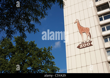 A giraffe sign outside of Zoologischer Garten station points to the zoo in Berlin, Germany. Stock Photo