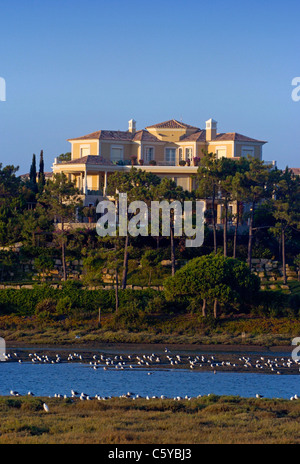 Large detached luxury property on the edge of the Ria Formosa Nature Reserve near Quinta do Lago in the Algarve region Portugal. Stock Photo