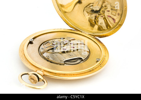 Inside of a gold pocket watch Stock Photo