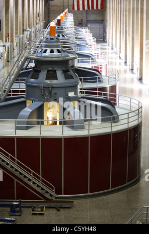 Huge turbines in a row inside of Hoover Dam. Stock Photo