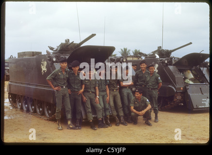 group of soldiers standing next to APCs ARVN Army of Republic of Vietnam troops during Vietnam War 1971 Stock Photo
