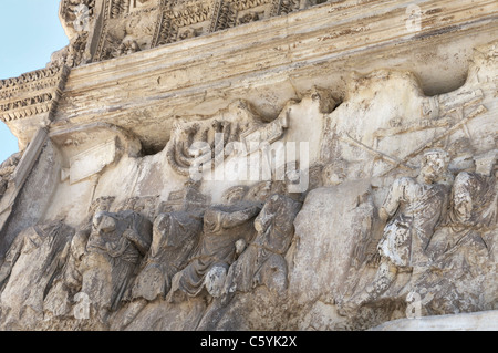 Relief sculpting on the Arch of Titus in Rome depicting the roman sacking of Jerusalem in 70 AD Stock Photo