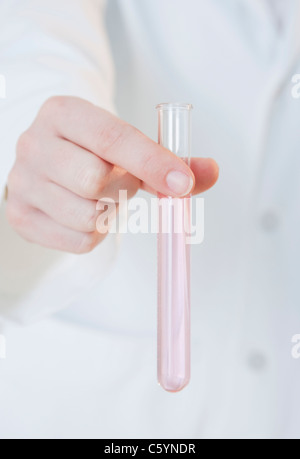 USA, Illinois, Metamora, close up of woman's hand holding laboratory vial Stock Photo