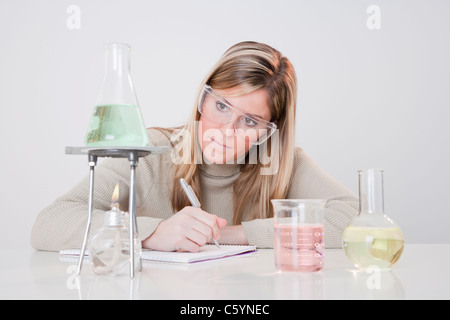 USA, Illinois, Metamora, woman working with laboratory glassware Stock Photo