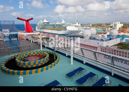 Carnival Ecstasy and two Royal Caribbean cruise ships at port in Cozumel, Mexico in the Caribbean Sea Stock Photo
