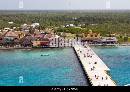 Cruise ship passengers walking on pier at port of Cozumel, Mexico in the Caribbean Sea Stock Photo