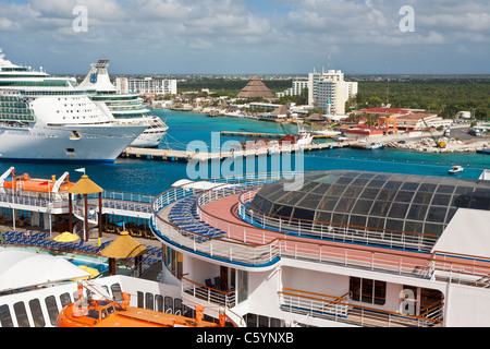 Carnival Ecstasy and two Royal Caribbean cruise ships at port in Cozumel, Mexico in the Caribbean Sea Stock Photo