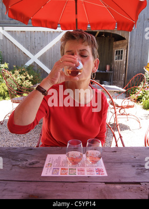 Woman tasting wine at Croteaux Vineyards in Southold, New York, on Long Island's North Fork,© KAndriotis, July 16, 2011 Stock Photo