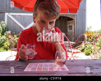 Woman tasting wine at Croteaux Vineyards in Southold, New York, on Long Island's North Fork,© KAndriotis, July 16, 2011 Stock Photo