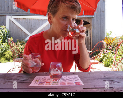 Woman tasting wine at Croteaux Vineyards in Southold, New York, on Long Island's North Fork,© KAndriotis, July 16, 2011 Stock Photo