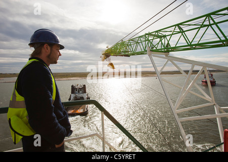 offshore worker work on deck do rigging slinging during anchor job ...