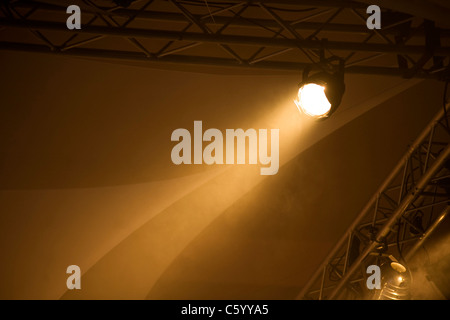 Single, orange, spotlight on a lighting rig Stock Photo