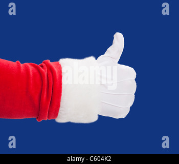 USA, Illinois, Metamora, Studio shot of Santa's hand with thumbs up against blue background Stock Photo