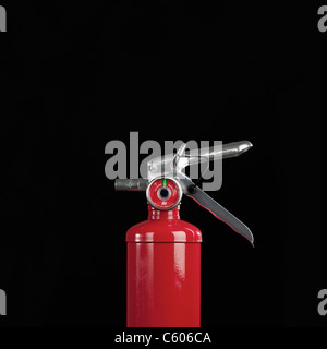 Fire extinguisher on black background, studio shot Stock Photo