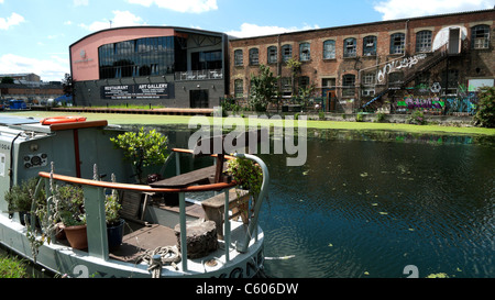 Lea Navigation River canal houseboat and Forman's Restaurant and Art Gallery Lea Valley East London UK  KATHY DEWITT Stock Photo