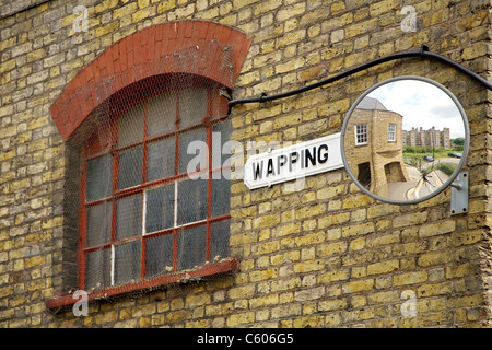 Wall mirror on a brick warehouse in Wapping in East London Stock Photo