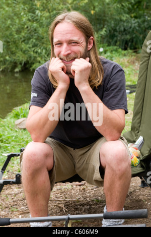 London Parliament Hill Hampstead Heath blond man with long hair beard laughing smiling happy male angler fisherman Stock Photo