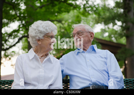 USA, Illinois, Metamora, Senior couple in sitting on bench park Stock Photo