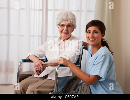 USA, Illinois, Metamora, Portrait of female nurse and senior woman on wheelchair Stock Photo