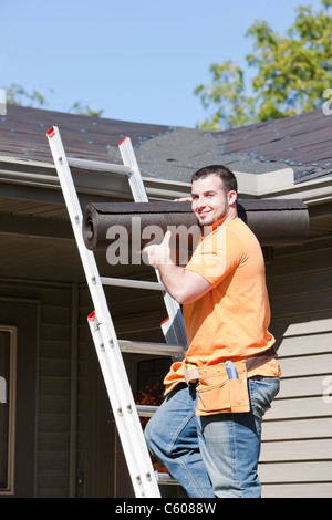 USA, Illinois, Metamora, Portrait of worker standing on ladder Stock Photo