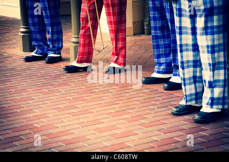 The feet of a jazz band dressed in period costumes. Stock Photo