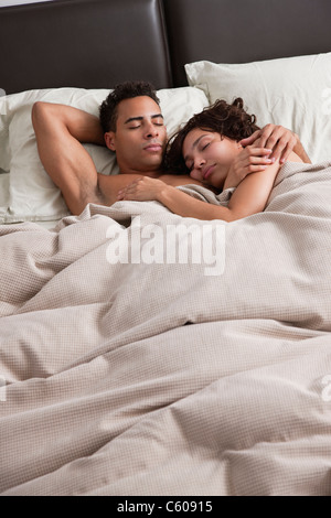 USA, New York City, couple asleep in bed Stock Photo