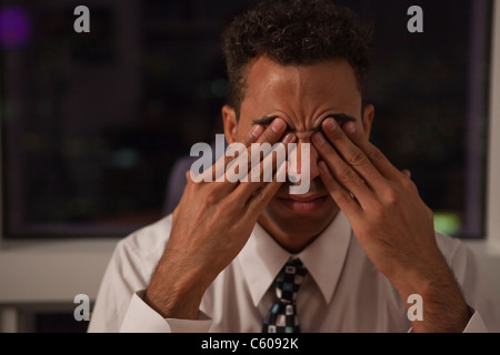 USA, New York City, businessman rubbing eyes Stock Photo