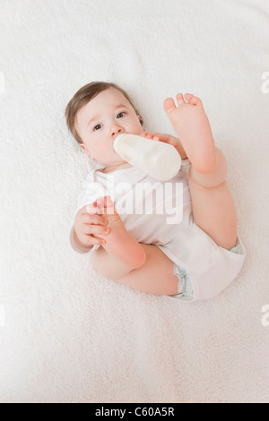 USA, Illinois, Metamora, baby boy (12-17 months) drinking milk from bottle Stock Photo