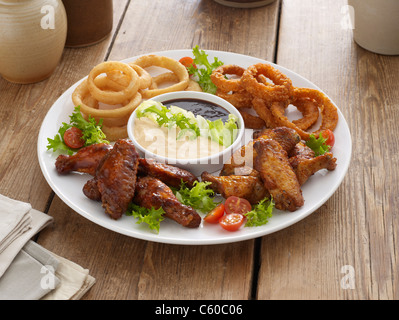 sharing plate of nibbles and dip Stock Photo