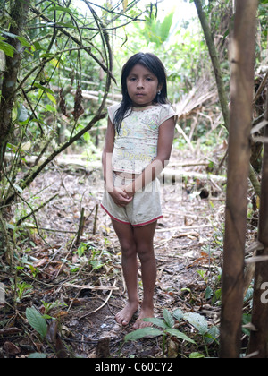 A young tribal girl deep in the Amazon Jungle. Shuar tribe. Stock Photo