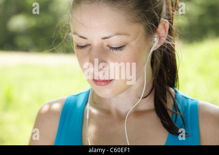 Runner wearing headphones Stock Photo