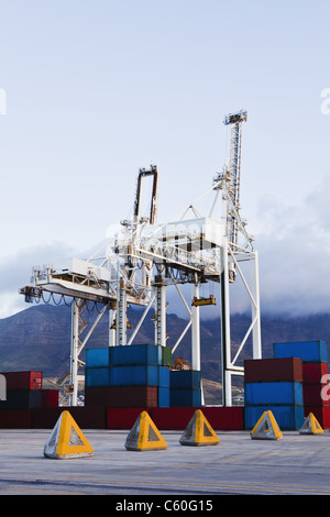 Containers and cranes in shipyard Stock Photo