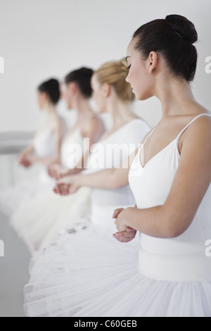 Ballet dancers holding hands in studio Stock Photo