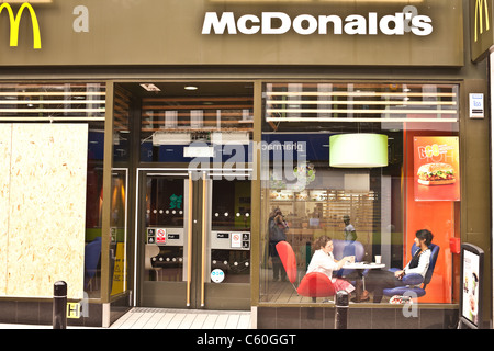 McDonald's shop boarded up after looting, arson and riots Stock Photo