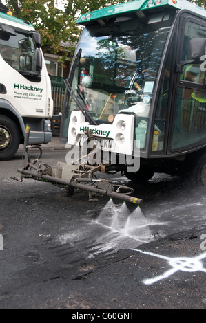 Hackney August 9th 2011. Clarence Road, scene of last night's riot. Council vehicles clearing up where cars were burnt out. Stock Photo