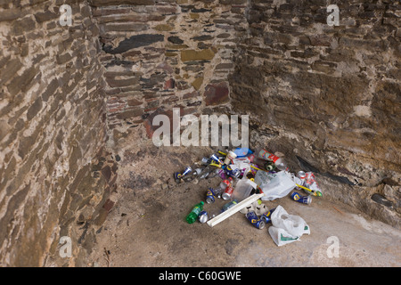 Beer cans and other rubbish collects in a corner of a heritage ...