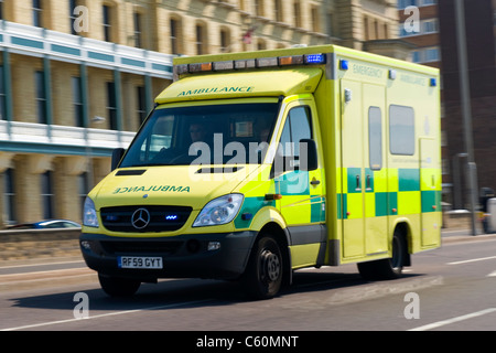 Hove actually East Sussex Mercedes Benz Sprinter 519 CDI ambulance or emergency services vehicle on call with lights flashing Stock Photo