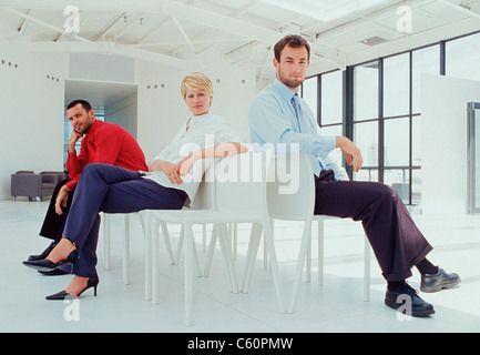 Business people sitting in lobby Stock Photo