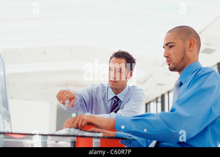 Businessmen working on computer Stock Photo