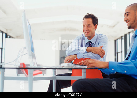 Businessmen working on computer Stock Photo