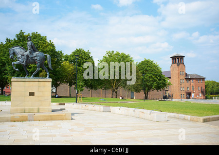 Statue of Bonnie Prince Charlie by Antony Stones with the Silk Museum in the background Cathedral Green Derby UK Stock Photo