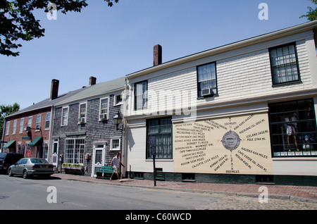 Massachusetts, Nantucket Island. Nantucket directional marker on the side of downtown building. Stock Photo