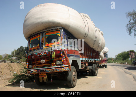 Heavily overloaded truck filled with cotton, parked in the desert near Ajmer Rajasthan Stock Photo