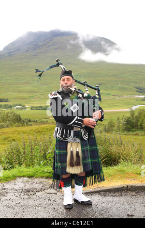 Bagpiper in the Highlands of Scotland