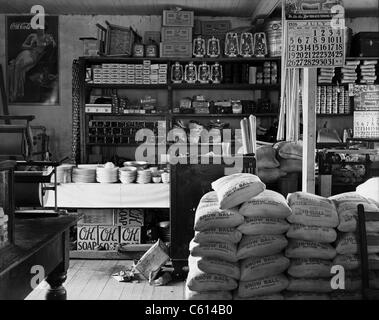 General store interior in Moundville Alabama. Goods for sale include flour salt cooking utensils canning jars soap kerosene lanterns rope and shotgun shells. 1936 photo by Walker Evans. (BSLOC 2010 18 102) Stock Photo