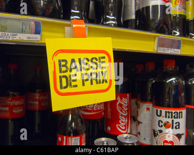 French Sign in Supermarket announcing Lower Prices on Soft Drinks, supermarket prices Stock Photo