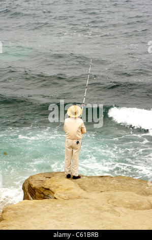 Man Fishing in the Pacific Ocean in La Jolla, California Stock Photo