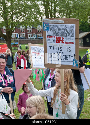 A festive atmosphere in Belmont Park as young protestors wear hats and hold placards as part of the May Day demonstration. Stock Photo